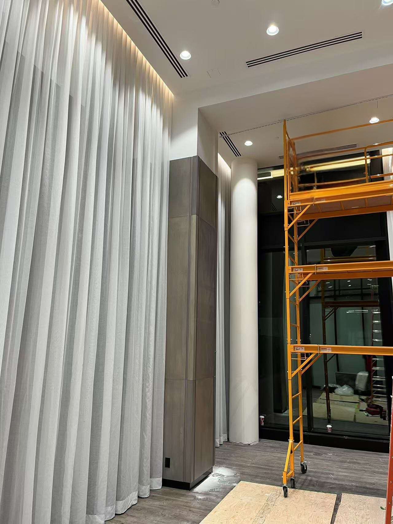Hotel lobby high ceiling sheer drapery installation